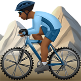 Person Mountain Biking: Medium-Dark Skin Tone on Apple iOS 13.1