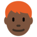 Man: Dark Skin Tone, Red Hair